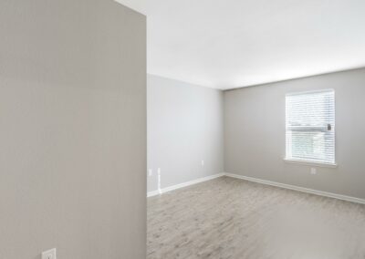 View of a spacious, unfurnished Austin, TX apartment bedroom at Goodnight Commons